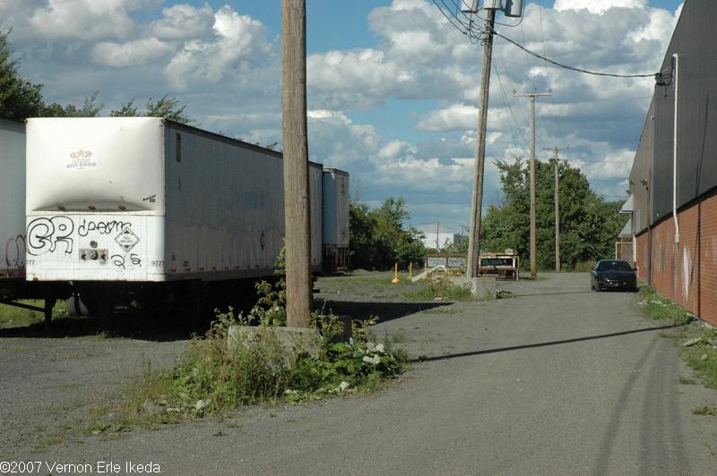 Standing next to the building just east of the Terrarium shopping centre just south of Rue Holiday looking eastward along the right of way.